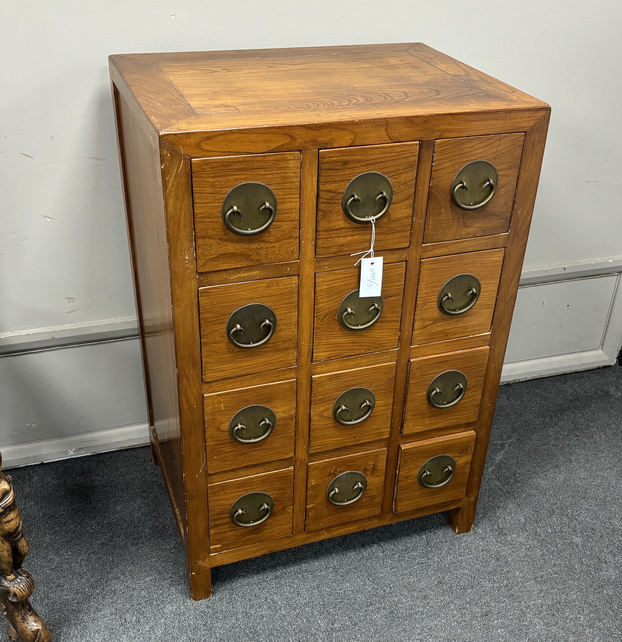 A Chinese jumu chest of twelve drawers, width 61cm, depth 45cm, height 91cm.